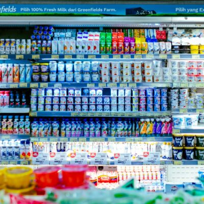 Vibrant shelves of diverse dairy products in a West Java supermarket.