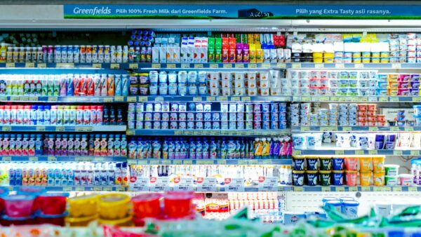 Vibrant shelves of diverse dairy products in a West Java supermarket.